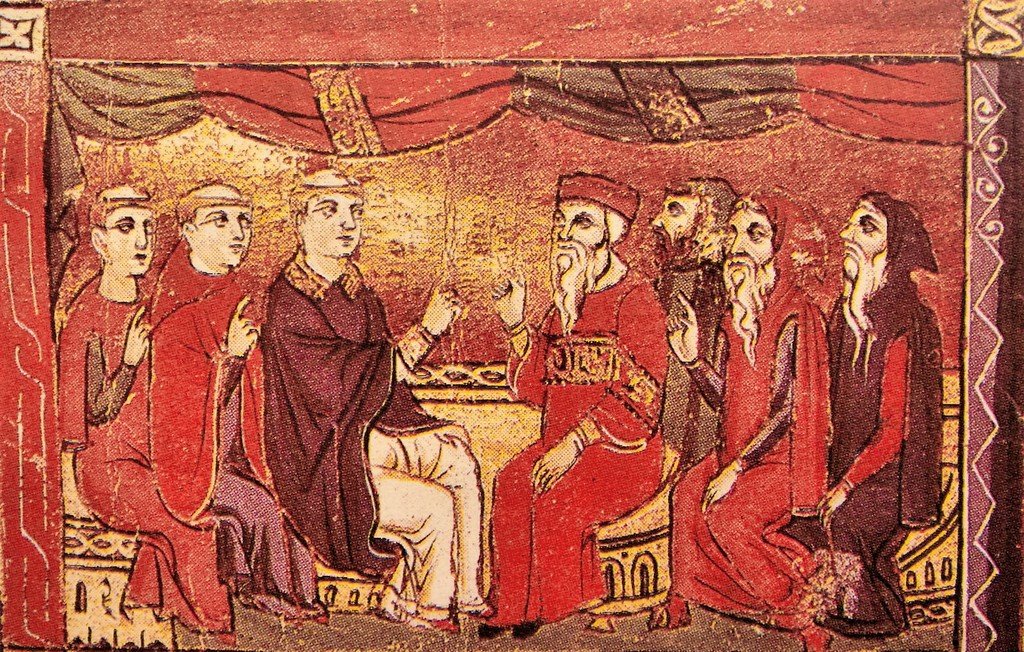 الصورة تظهر مشهدًا تاريخيًا يُحتمل أن يكون من العصور الوسطى. في المنتصف، يجلس رجلان على مقعد، واحد يرتدي لباسًا ملكيًا أو رسميًا، بينما الآخر في زي مختلف. يحيط بهم عدد من الأشخاص الذين يبدو أنهم يتناقشون أو يتبادلون الحديث. كل شخصية تظهر بتفاصيل دقيقة، مع تعابير وجه متنوعة، مما يدل على حوار نشط. الخلفية مليئة بالزخارف والألوان الدافئة، مما يضفي طابعًا مميزًا على المشهد.