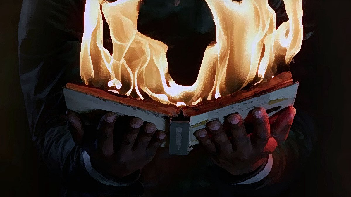 L'image montre un livre ouvert qui est en flammes. Les pages sont consumées par le feu, créant une impression intense et dramatique. Les mains qui tiennent le livre sont visibles, et l'arrière-plan est sombre, ce qui fait ressortir le contraste avec les flammes vives. Cette scène pourrait évoquer des thèmes de destruction, de passion ou de la lutte contre des idées.