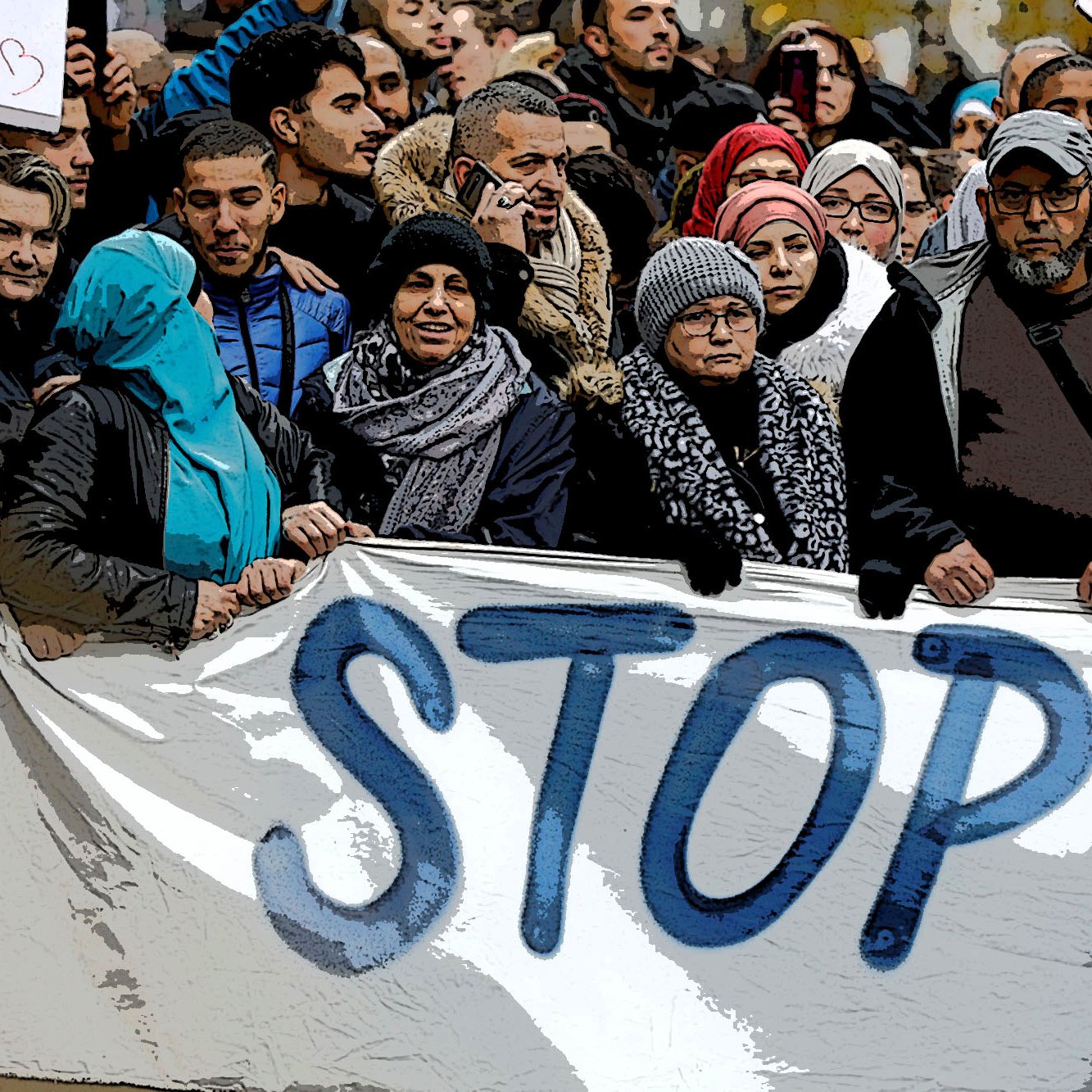 The image depicts a large group of people gathered together, holding a banner that prominently features the word "STOP." The individuals are dressed in various winter attire, including scarves and jackets, suggesting it may be cold. Some in the crowd appear to be wearing traditional clothing or head coverings. The atmosphere seems to convey a sense of unity and purpose, likely indicating a collective protest or demonstration. There are additional signs raised around the crowd, emphasizing their message.