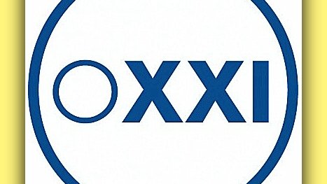 L'image présente un logo composé d'un cercle bleu. À l'intérieur, on trouve un petit cercle à gauche suivi de la mention "XXI" en lettres majuscules. Le fond est blanc, ce qui met en valeur le design minimaliste et épuré du logo.