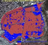 L'image représente une carte de la ville de Diyarbakır, en Turquie, où différentes zones sont colorées. Les zones en rouge et bleu semblent indiquer des classifications spécifiques, possiblement liées à des projets de développement urbain, des zones protégées ou d'autres catégories. La carte a un format aérien, et on peut voir le tracé des routes et des infrastructures urbaines. Les couleurs distinctes aident à visualiser la répartition de ces zones au sein de la ville.