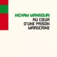 L'image présente la couverture d'un livre intitulé "Au cœur d'une prison marocaine" par Hicham Mansouri. Le design de la couverture est minimaliste avec un fond clair. En haut, des bandes de couleur rouge et verte sont visibles. Le titre du livre est écrit en lettres majuscules noir sur un fond crème, avec le nom de l'auteur en bas de la couverture. L'éditeur est mentionné à gauche sous le nom de l'auteur.