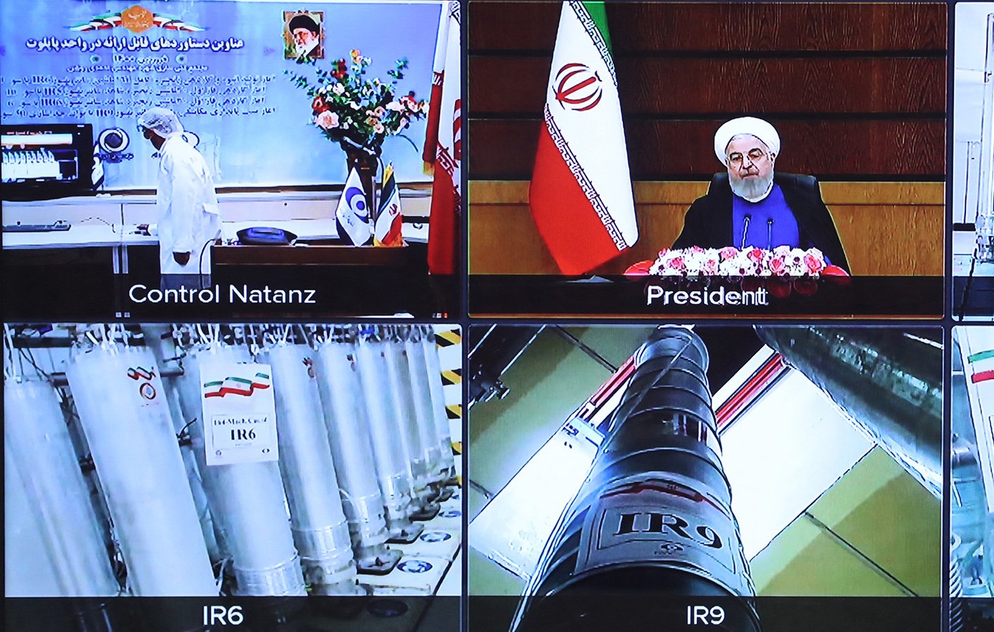 در این تصویر، چندین پنل نمایش داده شده است. در بالای تصویر، یک پنل مربوط به "کنترل نطنز" دیده میشود که اطلاعاتی درباره فعالیتهای این مرکز را نشان میدهد. در مرکز تصویر، رئیسجمهور ایران در حال صحبت کردن و ارائه سخنرانی است و در پسزمینه پرچم ایران قرار دارد. در قسمت پایین تصویر، چندین پنل دیگر وجود دارد که هرکدام به نوعی از سانتریفیوژهای مختلف (IR5، IR6، IR9 و IR8) مربوط میشود و نام و مدل آنها بر روی برچسبها نوشته شده است. این تصویر به وضوح تمرکز بر روی فناوری هستهای ایران و پیشرفتهای مربوط به آن را نشان میدهد.
