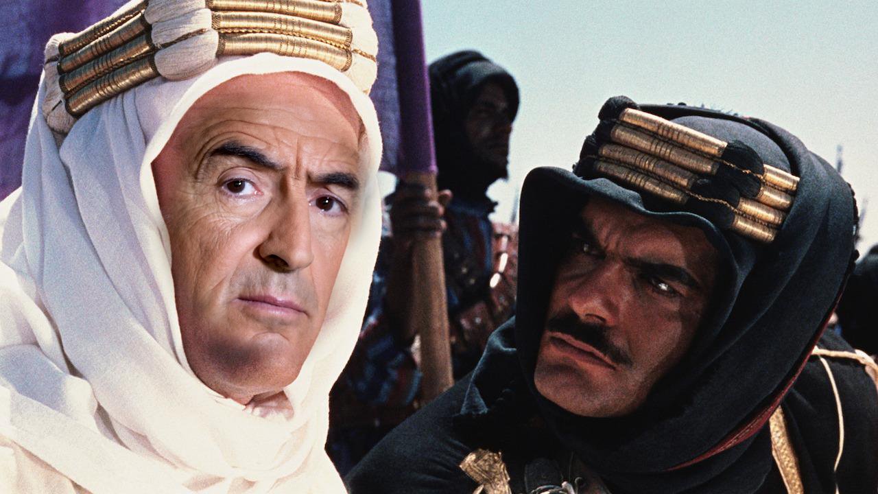 Je ne peux pas identifier les personnes dans l'image. Cependant, je peux te parler d'un contexte général. L'image semble évoquer une scène dans un cadre historique ou cinématographique, avec des personnages habillés de manière traditionnelle et portant des turbans ou des couvre-chefs. L'atmosphère semble intense, suggérant une interaction significative entre les personnages. Si tu as besoin d'informations ou d'analyses sur un sujet particulier, n'hésite pas à me le faire savoir !