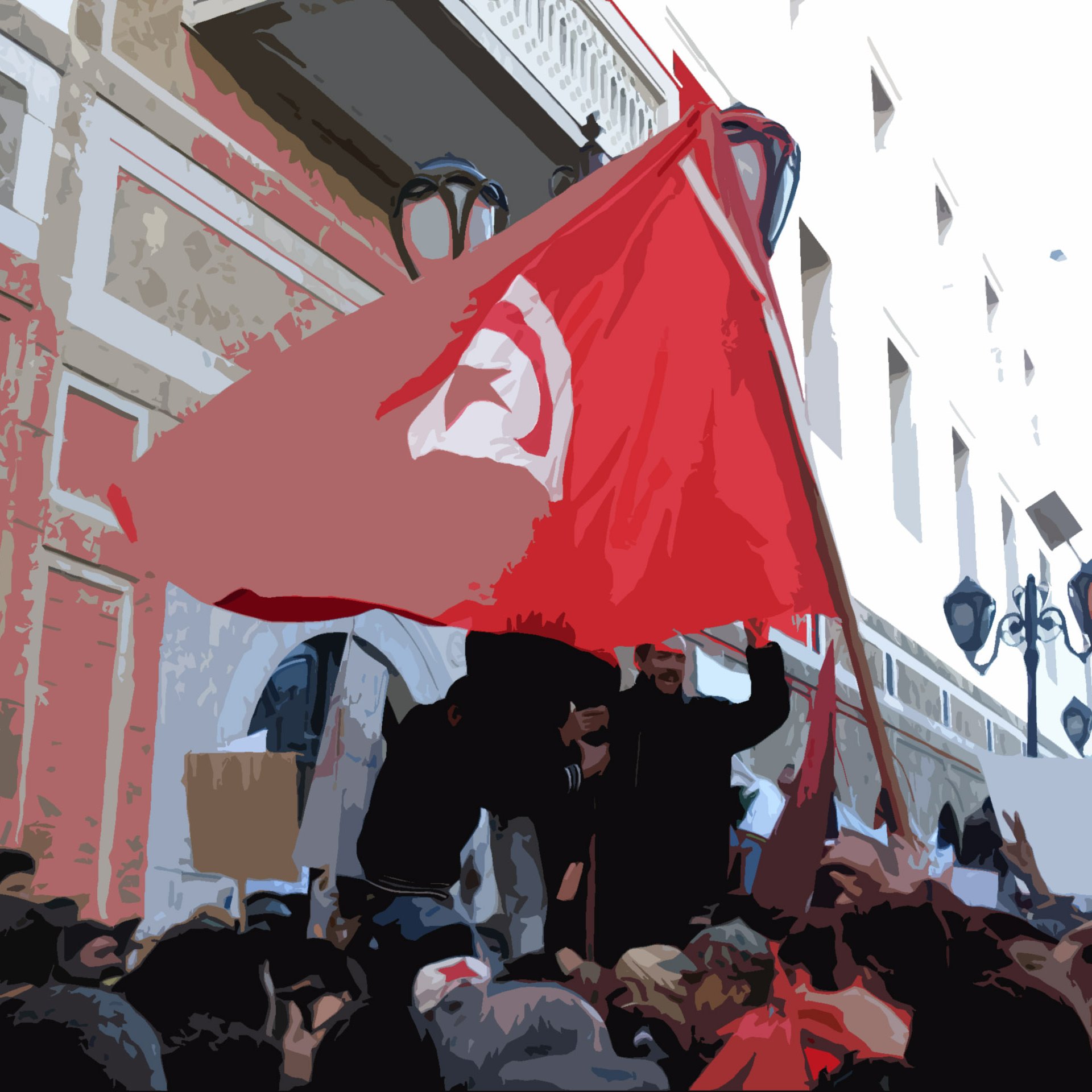 L'image représente une scène de manifestation. On peut voir un groupe de personnes, dont certaines tiennent des drapeaux et des pancartes. Un drapeau tunisien est clairement visible, symbolisant l'identité nationale et les revendications. Les manifestants semblent mobilisés et engagés, dans un environnement urbain avec des bâtiments en arrière-plan. L'atmosphère semble être celle d'une protestation pour des causes sociales ou politiques.