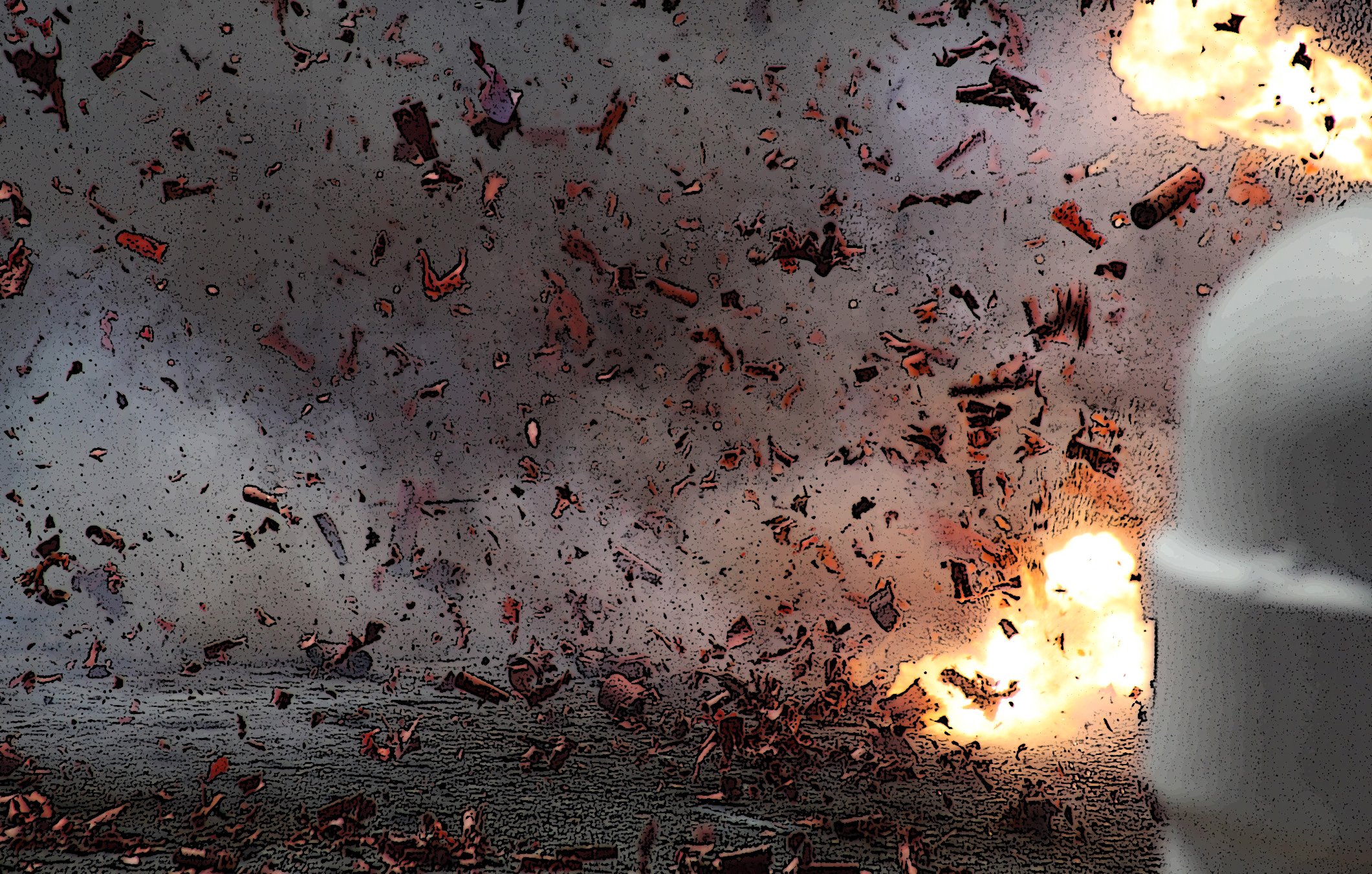 L'image montre une scène chaotique avec des débris projetés dans l'air, suggérant une explosion. Des fragments sont visibles autour, ce qui donne une impression d'énergie et de mouvement intense. En arrière-plan, des éclats lumineux peuvent indiquer la source de l'explosion, créant une atmosphère dramatique et dynamique. L'ensemble dégage une forte sensation d'action.