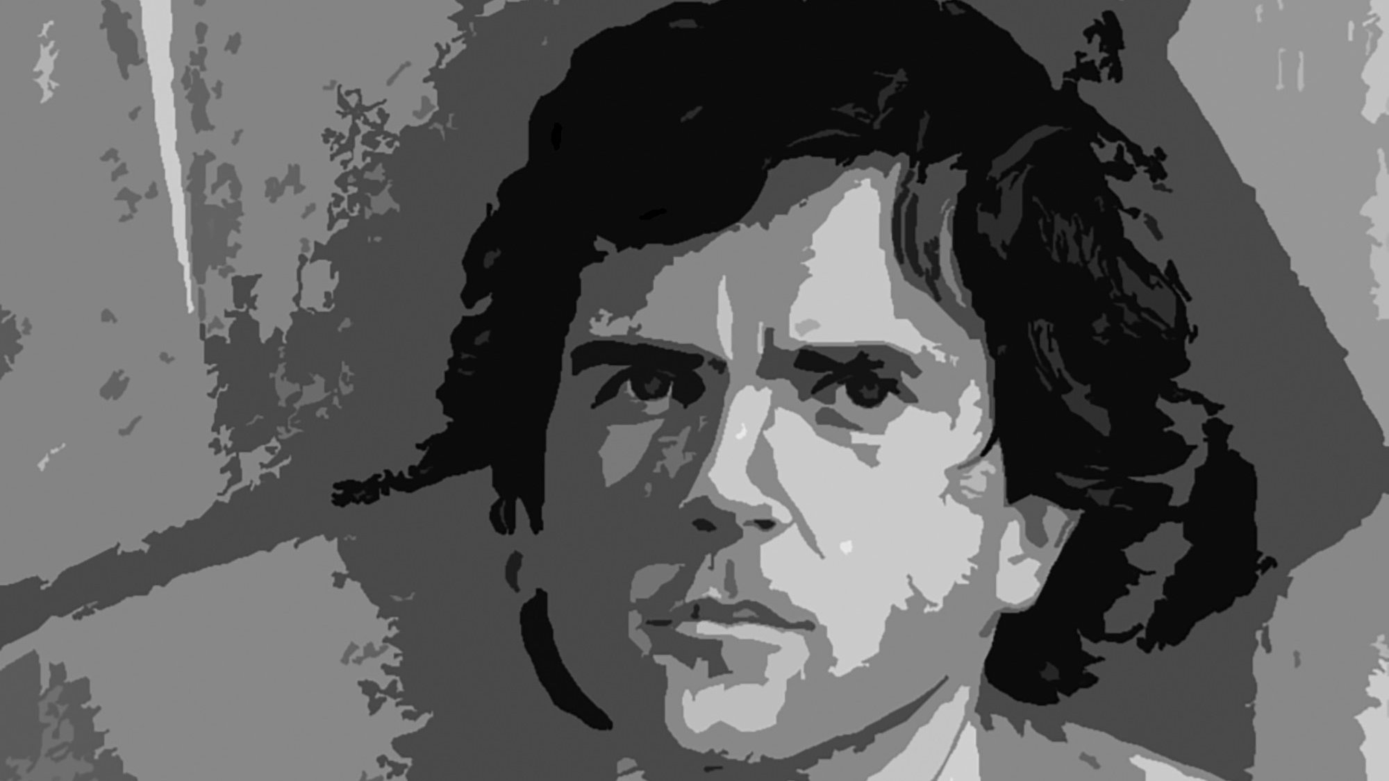 L'image montre un portrait stylisé d'un homme avec des cheveux sombres et ondulés. Son expression semble pensive ou sérieuse, et il est illuminé par une lumière qui met en valeur son visage. L'arrière-plan est flou et en nuances de gris, ce qui attire l'attention sur le personnage principal. L'ensemble de l'image donne une impression artistique et graphique.