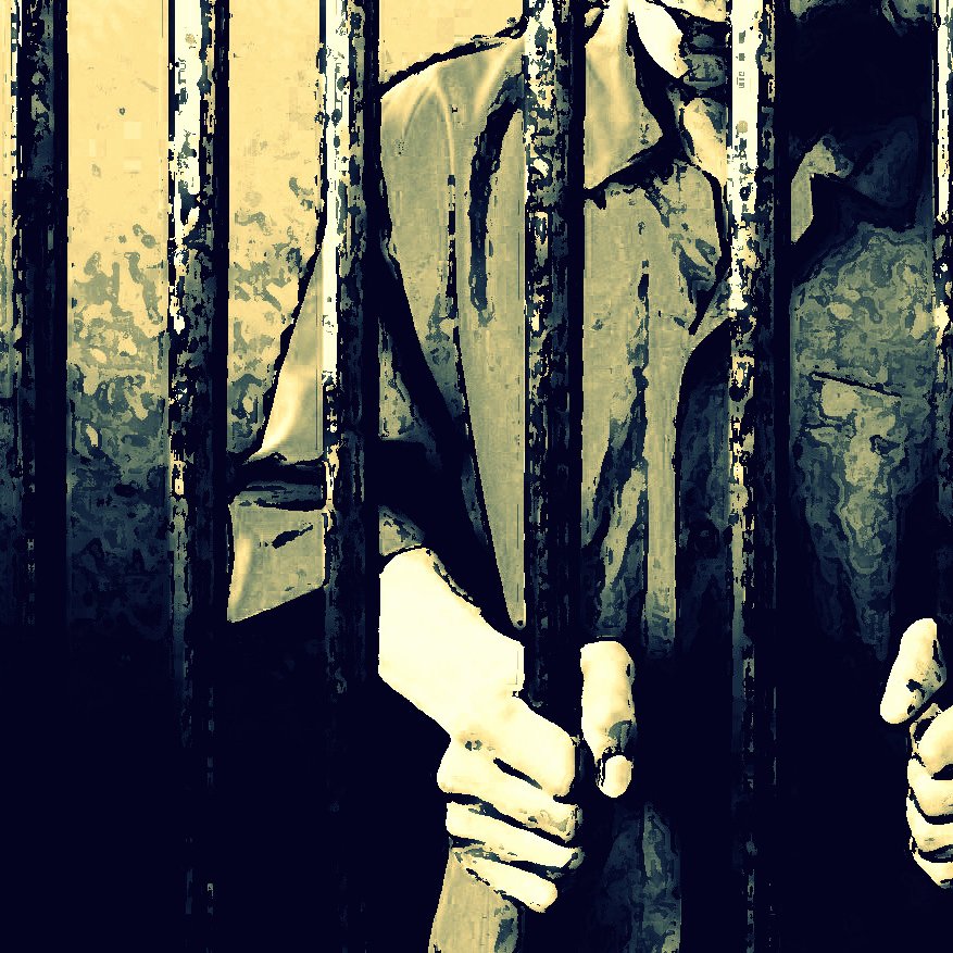 The image depicts a person standing behind bars, likely in a prison setting. The figure appears to be gripping the bars with both hands, suggesting a feeling of confinement. The scene is characterized by shadowy lighting and a muted color palette, creating an atmosphere of isolation and despair. The focus is primarily on the hands and the bars, emphasizing the sense of imprisonment.