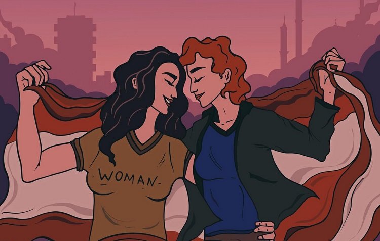 L'immagine rappresenta due donne che si abbracciano, con un paesaggio urbano sullo sfondo. Una delle donne indossa una maglietta con la scritta "WOMAN", mentre l'altra ha una maglietta blu. Entrambe sono avvolte in un grande drappo che riporta i colori della bandiera del Libano, creando un senso di unità e solidarietà. Il cielo sopra di loro è di un colore sfumato, dai toni rosa e violacei, che aggiunge un'atmosfera di speranza e connessione.