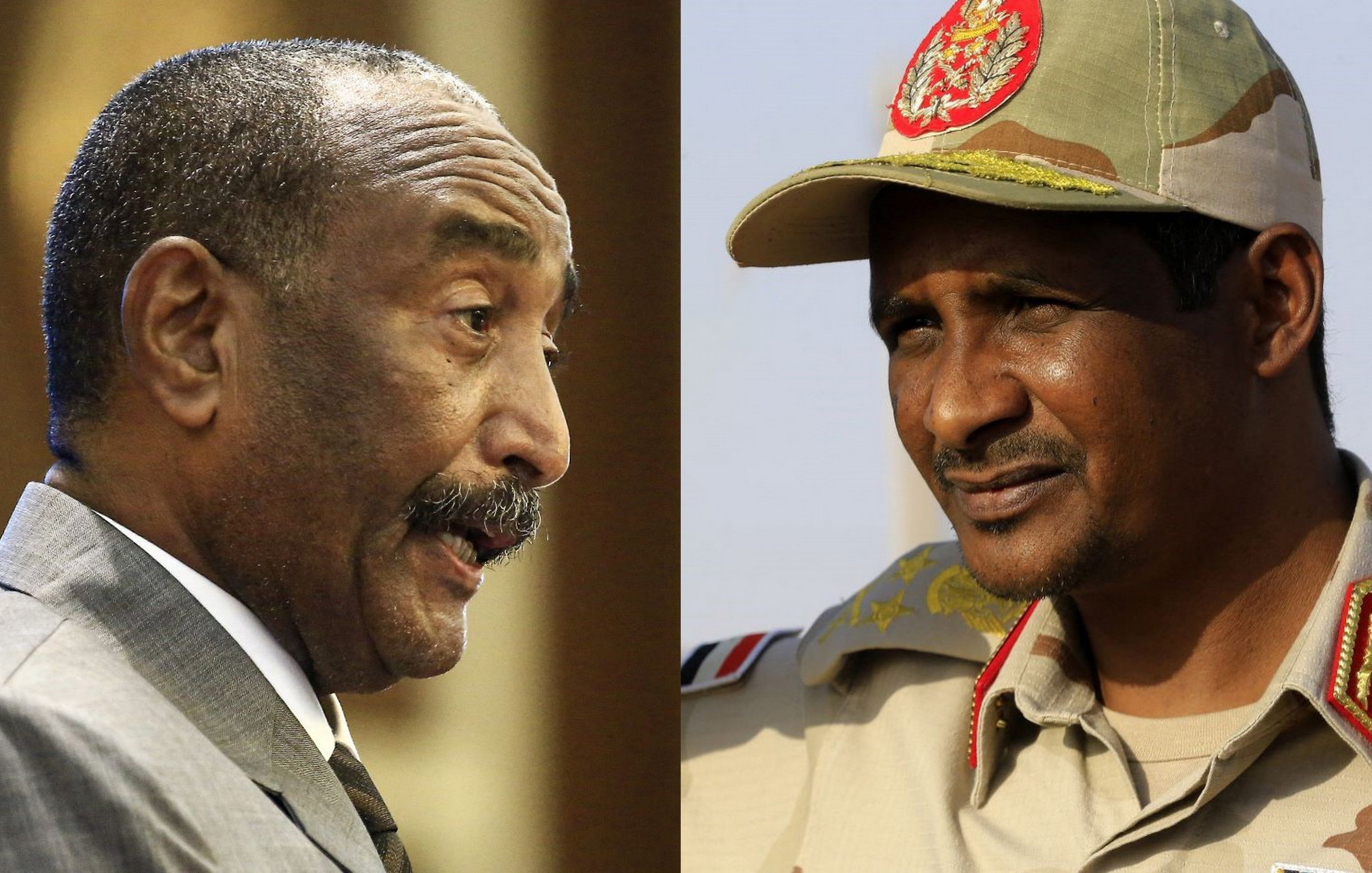 L'immagine mostra due uomini in uniformi militari e abiti formali. A sinistra, uno di loro parla con un'espressione seria, probabilmente in un contesto di conferenza o incontro ufficiale. A destra, l'altro uomo è vestito con una divisa da generale e ha un'aria decisa, con il cappello ben impostato sulla testa. Lo sfondo è semplice e mette in risalto i soggetti, suggerendo un contesto di leadership o autorità.