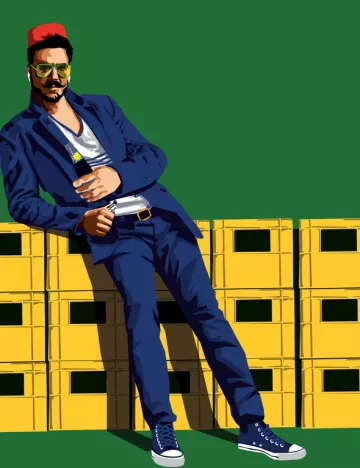 L'image représente un homme élégant, vêtu d'une veste bleue et d'un tee-shirt blanc, avec un pantalon assorti. Il est appuyé contre une pile de caisses jaunes et porte des lunettes de soleil. Son style est décontracté, avec des baskets bleues. Il semble confiant et décontracté, ajoutant une touche de modernité à son apparence. Le fond est vert, ce qui crée un contraste saisissant avec sa tenue.